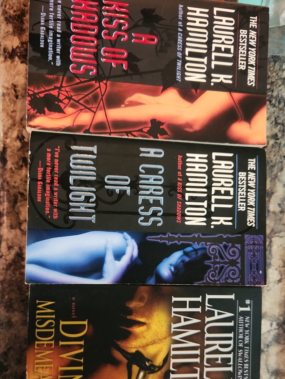 Laurell K Hamilton Paperbacks - Divine Misdemeanors, Kiss Of Shadows, Caress Of